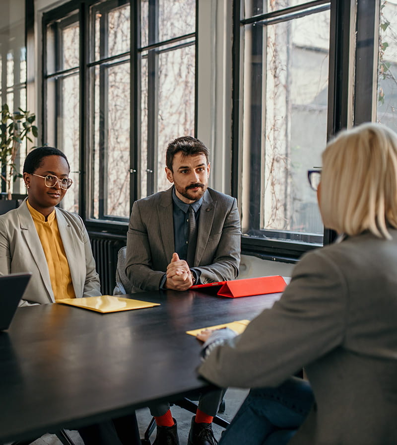 Interviewers speaking with a potential employee