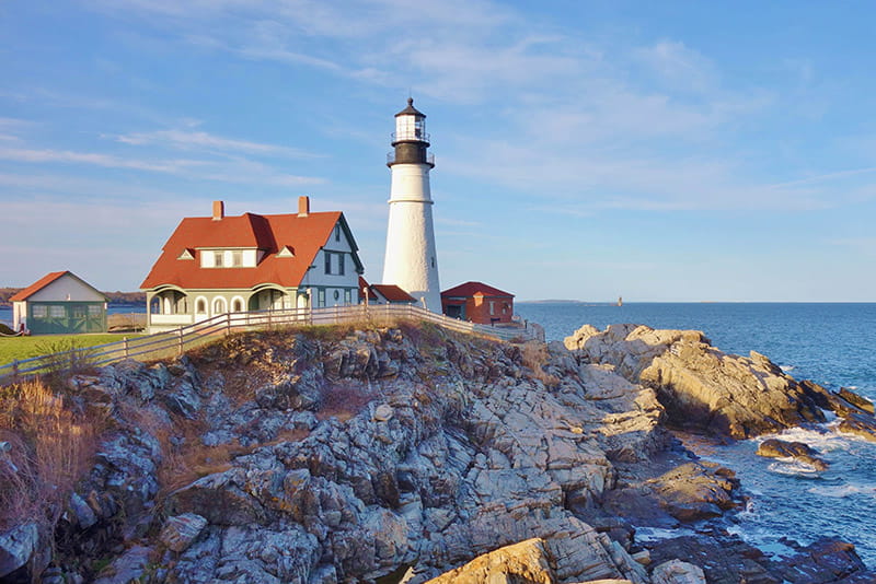 Maine lighthouse with coastline
